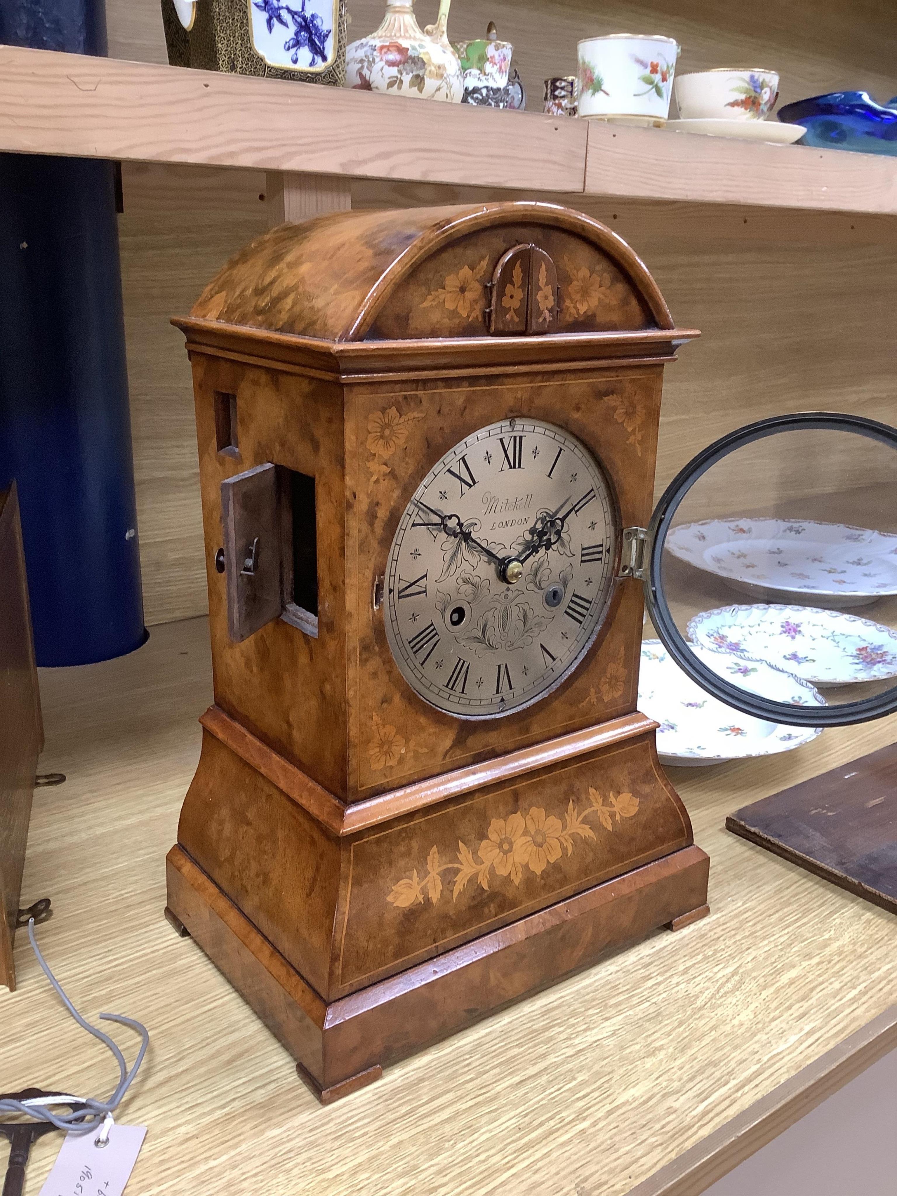 A Victorian burr walnut and marquetry dome topped cuckoo clock, signed Mitchell, London, with oak bracket, 41cm high